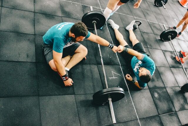 Personal trainer guides man through his fitness journey